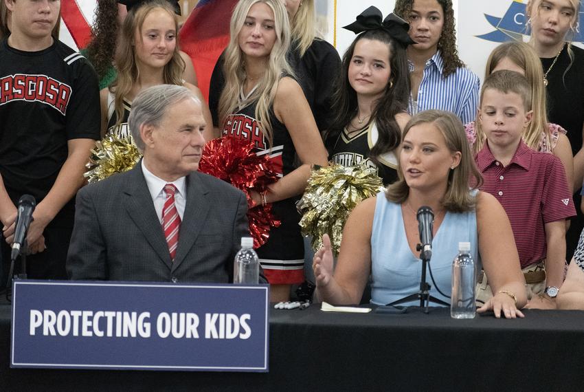 Gov. Greg Abbott and Rep. Caroline Fairly, R-Amarillo, speak at a ceremonial bill signing for HB 1481 and SB 2420 at AmTech Career Academy in Amarillo. HB 1481 was the first bill Fairly filed after her election in 2024.
