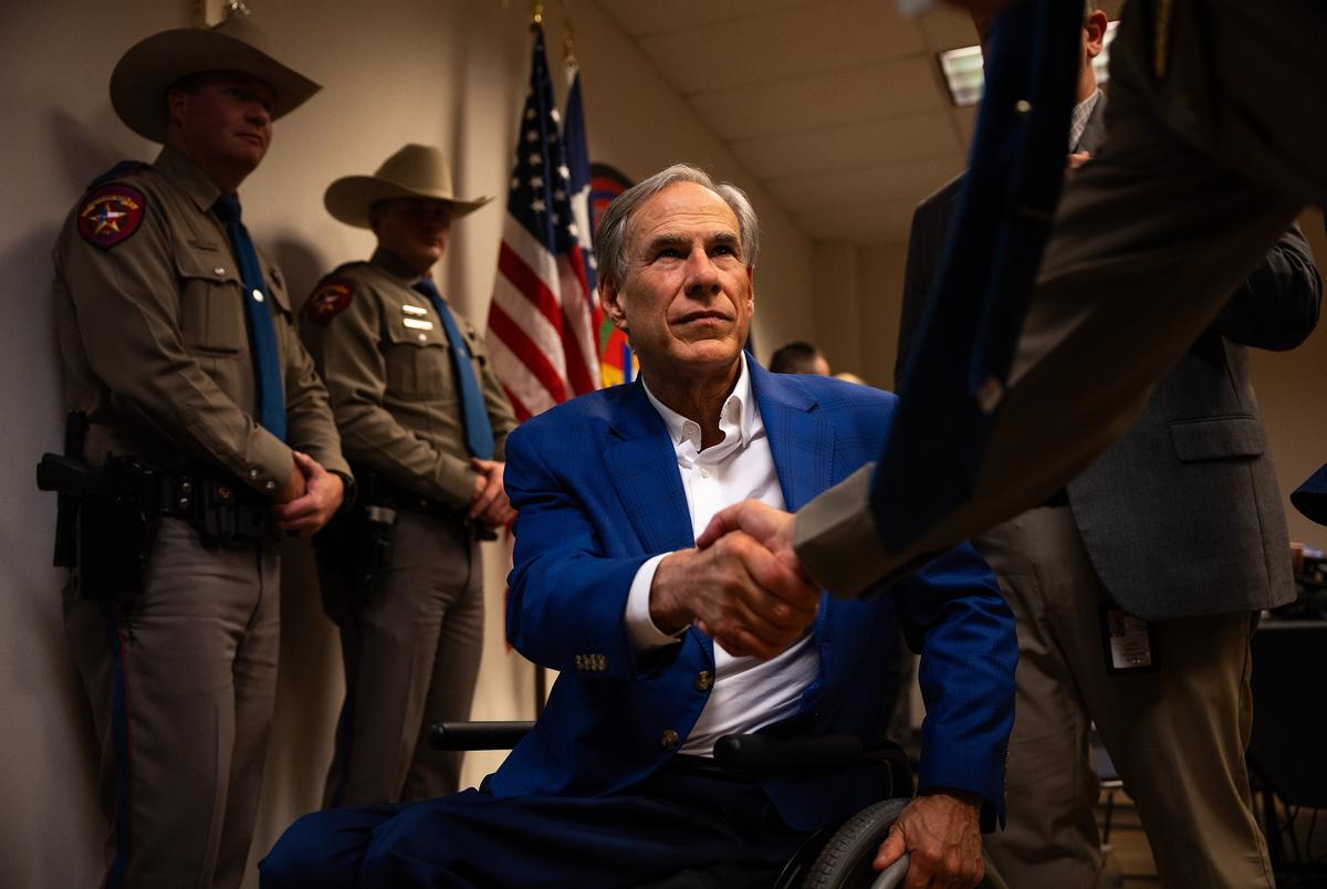 Gov. Greg Abbott shakes hands with officers after a press conference to announce a new public safety initiative on Wednesday, Oct. 1, 2025, in Houston.