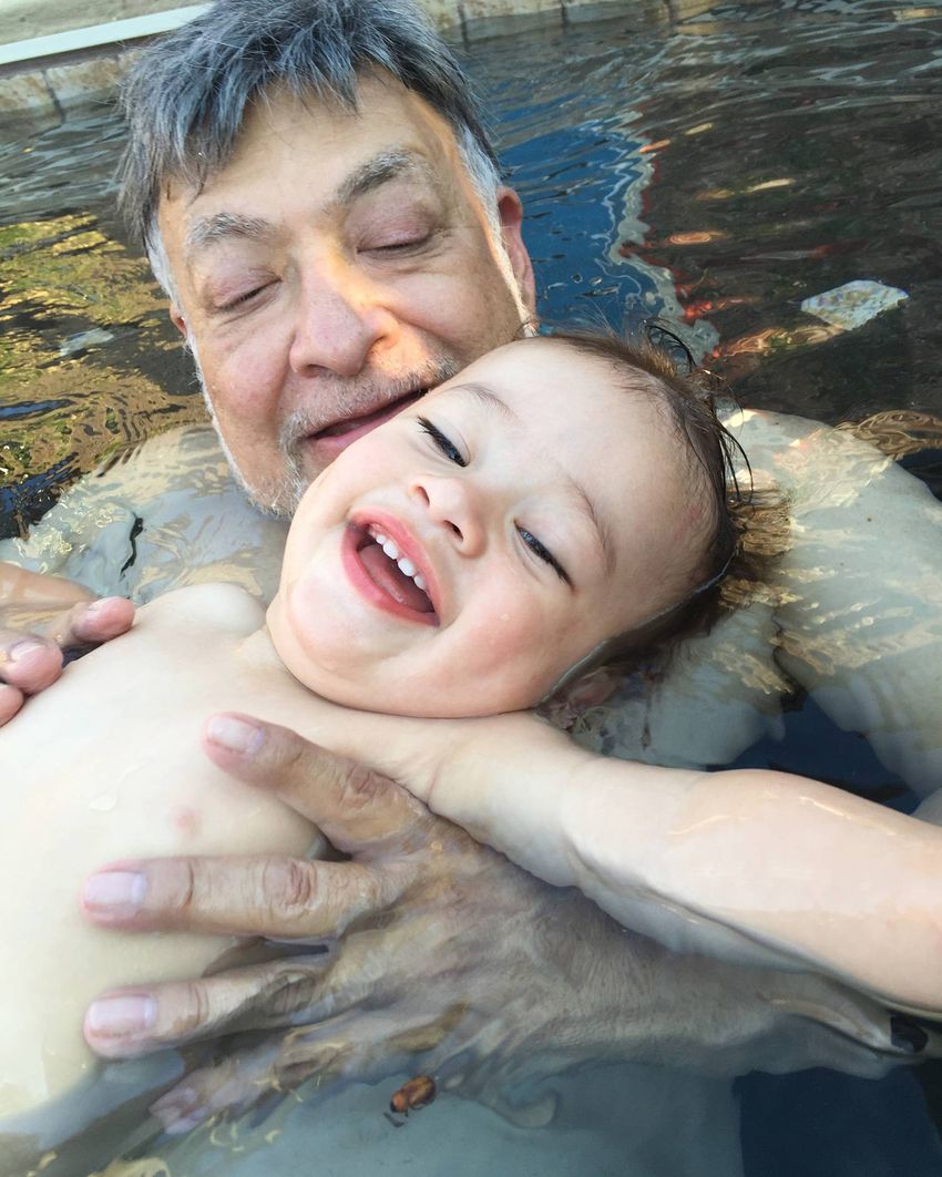 Dr. Juan Fitz swims with his son Aiden in 2016.