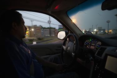 Juan Lopez works in the early hours of the day to pick up and transport bodies from private homes and hospital morgues to funeral homes. Since the recent surge of COVID-19 cases in the Rio Grande Valley, Lopez has seen a dramatic increase in work.