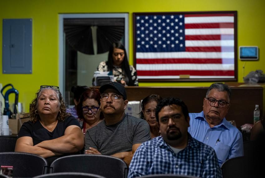 Attendees listen to speakers discuss new border wall contracts in Webb and Zapata counties at the No Border Wall Coalition’s emergency border wall town hall in El Cenizo on Feb. 15, 2023.