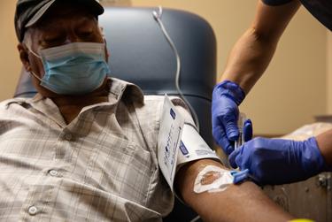 Isidro Bernardino receives a COVID-19 antibody infusion at the Titus Regional Medical Center in Mount Pleasant on Aug. 19, 2021.