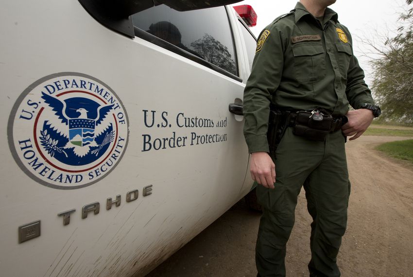 Border Patrol vehicles guard the fence between El Paso and Juarez.
