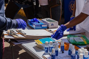 A supply station at a COVID-19 vaccine registration event in Irving on March 19, 2021.