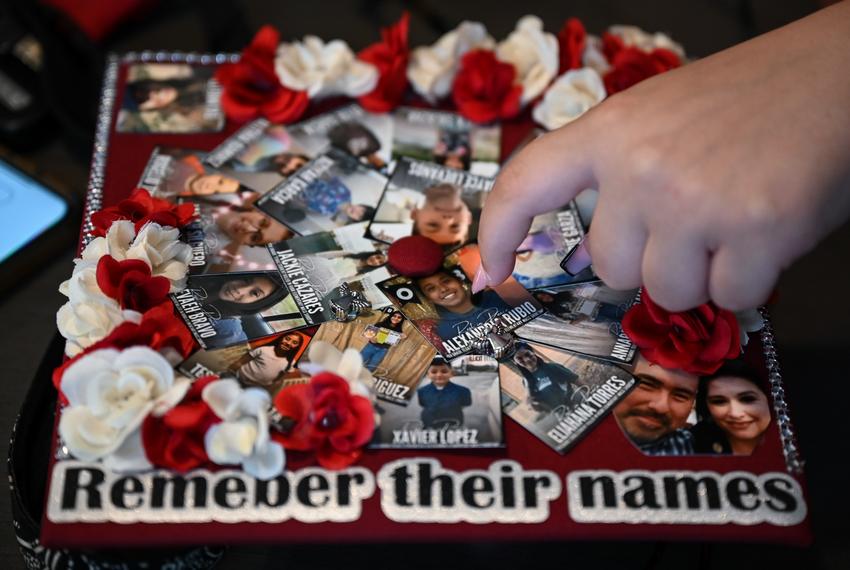 Gabby Quirova points to a photo on her graduation cap of Alexandria Rubio, one of the students she personally knew who was killed in the Uvalde mass shooting. She designed her cap to have the victims of the shooting on it so they could have their chance to walk across the stage, too.