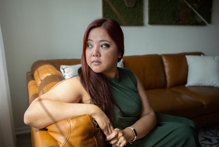 Executive director of Asian Texans for Justice Lily Trieu sits in her home in Austin, Texas. Sept. 14, 2022.