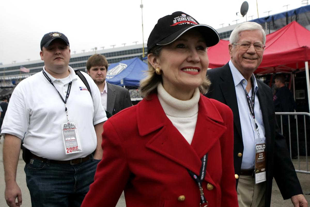 U.S. Sen. Kay Bailey Hutchison makes her way through pit row before the start of the Dickies 500 at the Texas Motor Speedway in Fort Worth on Nov. 5, 2006.