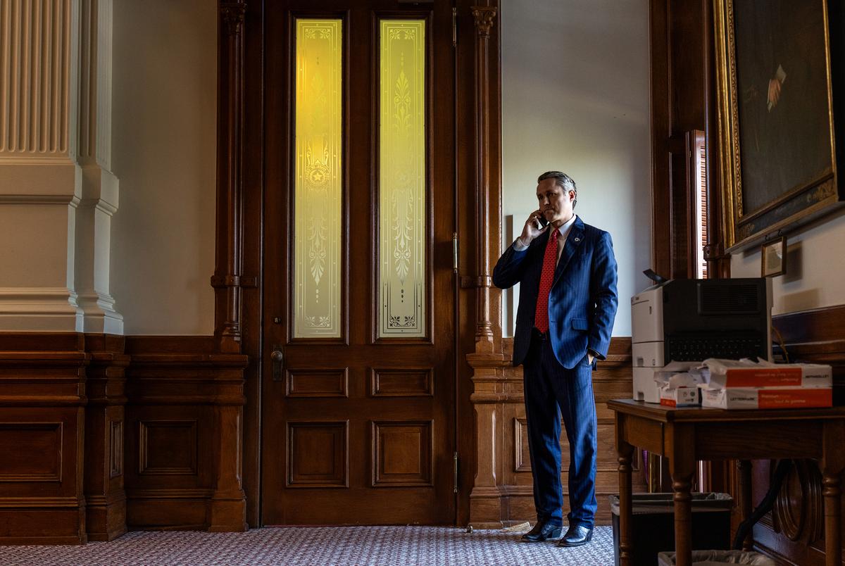 State Rep. Brian Harrison, R-	Midlothian, speaks on the phone in the House Chamber in Austin on April 10, 2025.