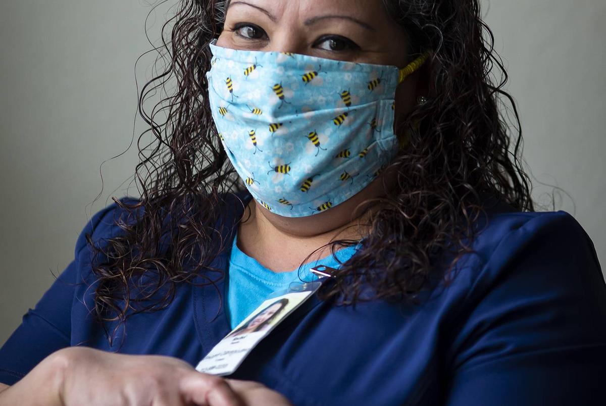 Health care worker Rachel Fuentes in her home in north Houston on Saturday, Feb. 6, 2020. Fuentes has been an in-home caregiver for elderly patients for the past 11 years. She is not eager to get the COVID-19 vaccine and hopes her current or future clients do not depend on it.