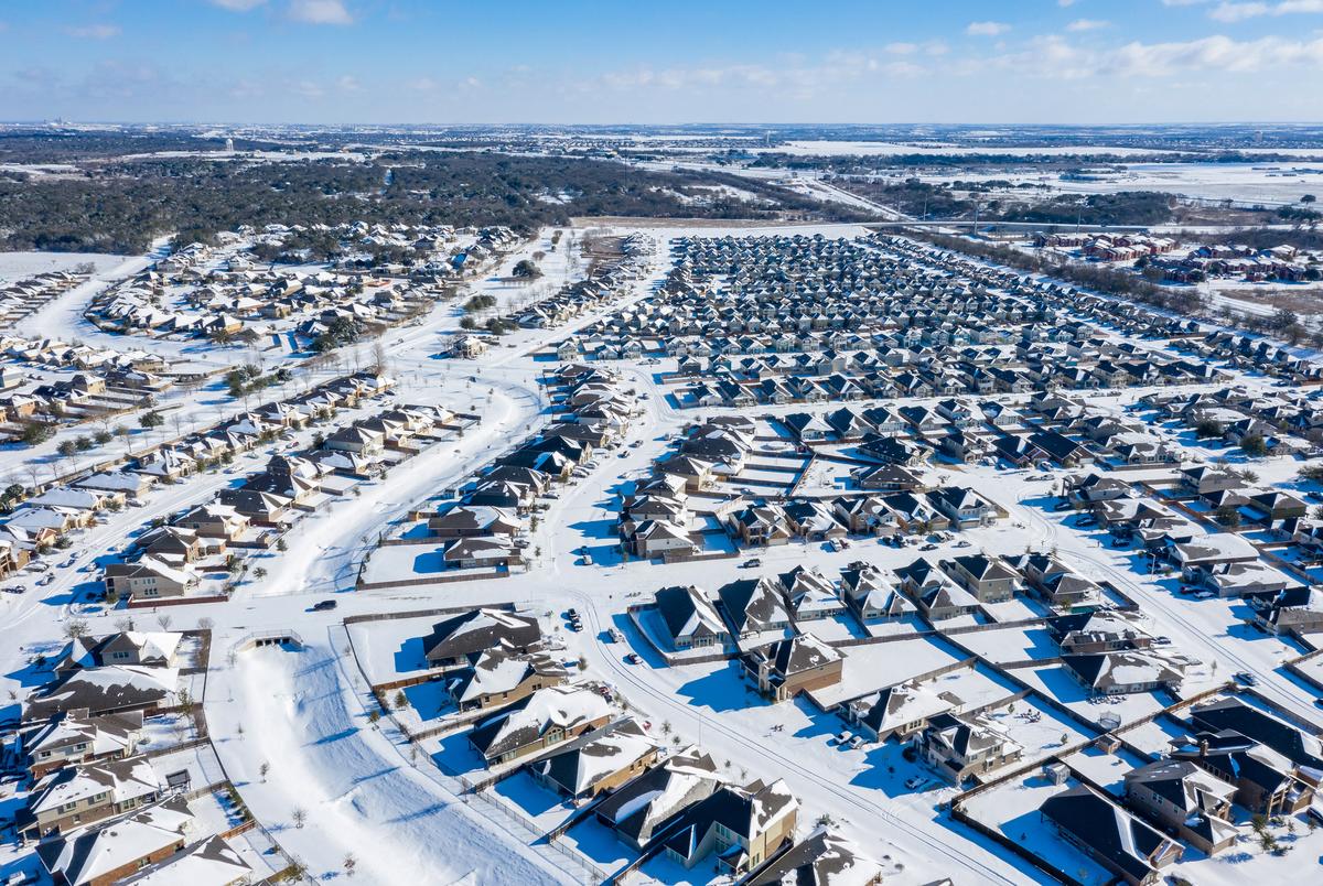 The Blanco Vista neighborhood of San Marcos is blanketed with several inches of snow as a massive winter weather system causes power outages across Texas on Feb. 15, 2021.