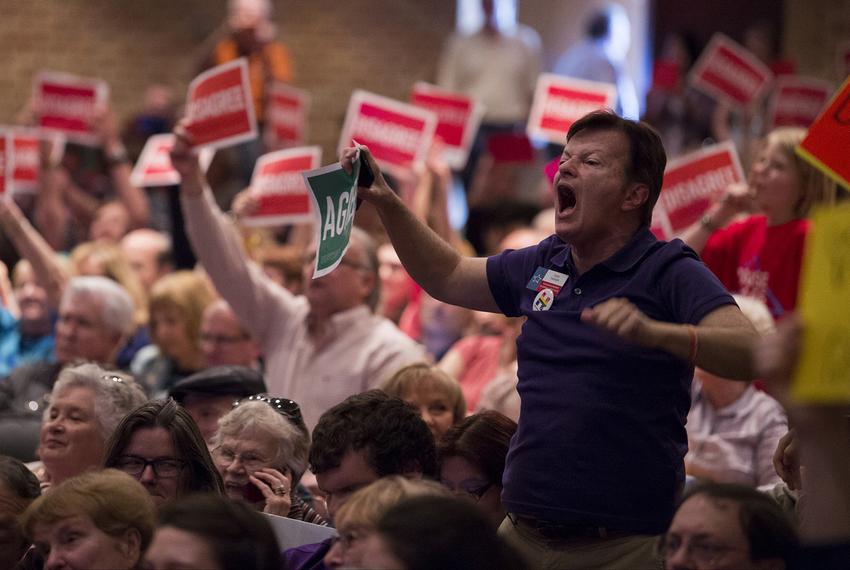 Constituents voice their opinions while Rep. Pete Sessions, R-Dallas, speaks during a town hall event at Richardson High School on March 18, 2017. 