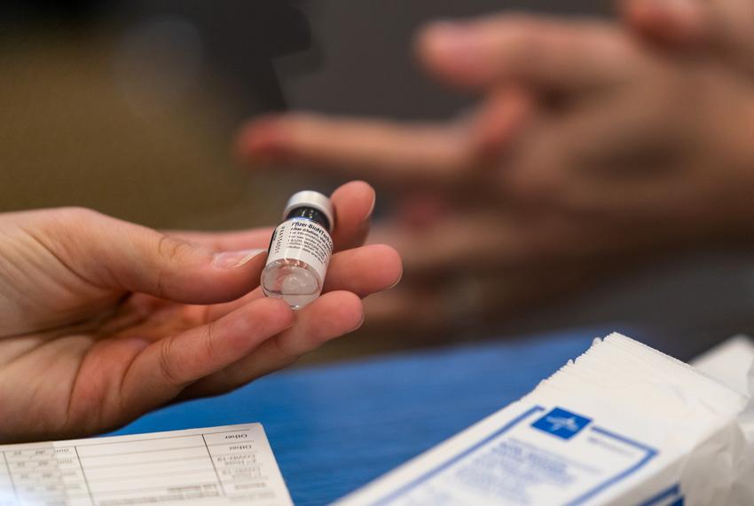 A vial containing the Pfizer-BioNTech CODID-19 vaccine is prepared to be administered to health care workers at the UT Health/Dell Medical School in downtown Austin on Dec 15, 2020.