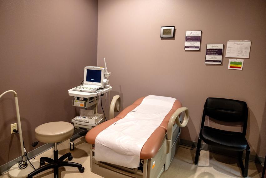 An ultrasound machine sits next to an empty patient bed at Whole Women’s Health of Austin on Sept. 1, 2021.