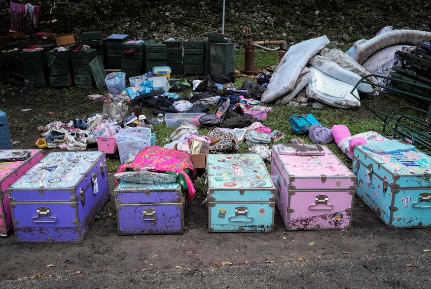 Campists' belongings lie on the ground following flooding on the Guadalupe River, at Camp Mystic, Hunt, on July 7, 2025.