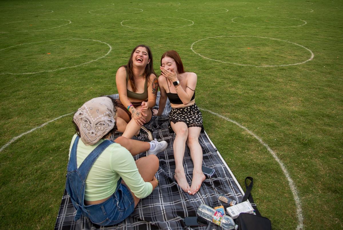 Carolina Rascon, Sarahi Diaz, and Suzanne Oviedo gather on the Discovery Green social distancing circles in Downtown Houston on June 13, 2021.