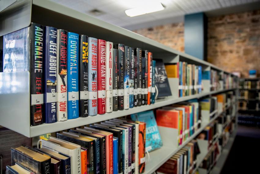 carrying books in library