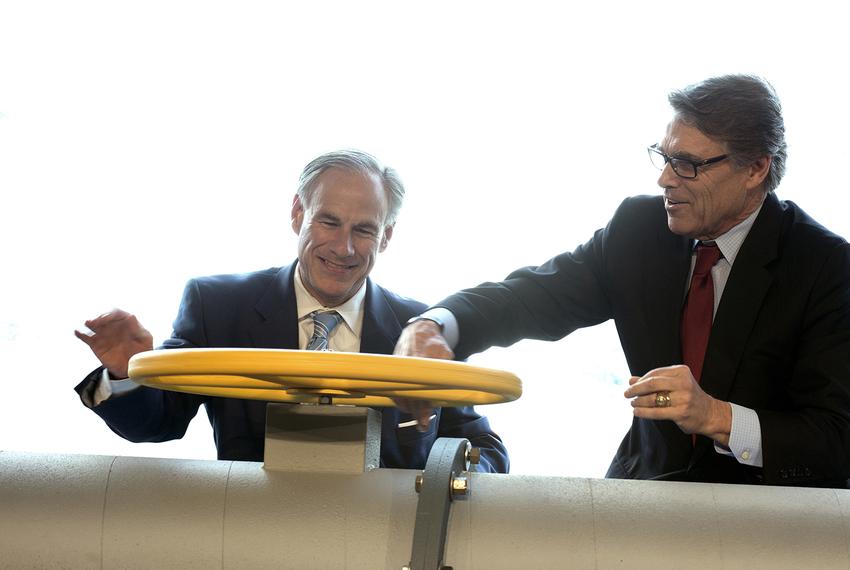 Texas Gov. Greg Abbott, left, and Secretary of Energy Rick Perry join the Petra Nova carbon capture and enhanced oil recovery system partners — NRG Energy, JX Nippon Oil and Gas and Hilcorp Energy — for a ribbon cutting ceremony at the NRG/ Petra Nova Power Plant in Thompsons on April 13, 2017.