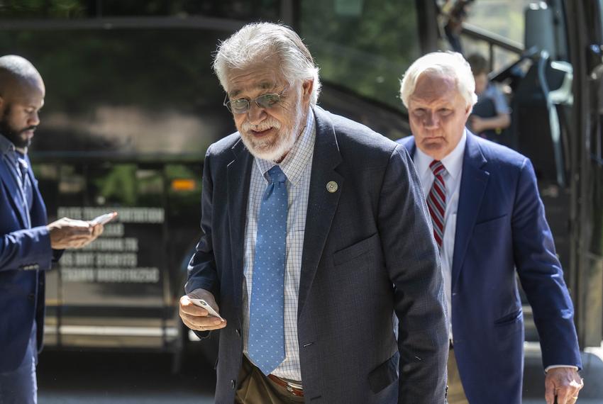 State Rep. Ray Lopez, D-San Antonio, followed by Rep. John Bryant, D-Dallas, gets off a charter bus from the Austin airport outside the State Archives building on the east side of the Texas Capitol upon their return to Austin following a two-week quorum break, on Monday, Aug. 18, 2025.