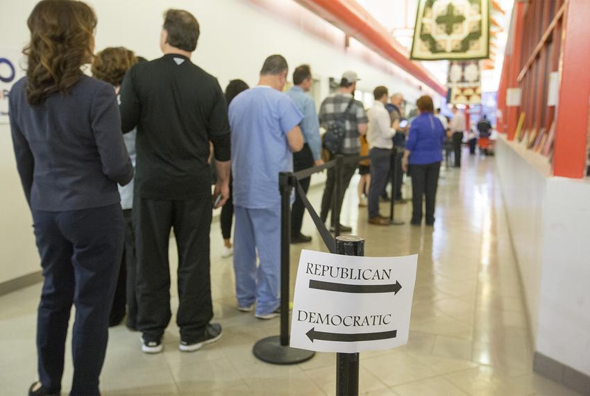 A long Democratic line and an empty Republican line as voters arrive to the polls in the last hour of the primaries near downtown Houston on Tuesday, March 6, 2018.