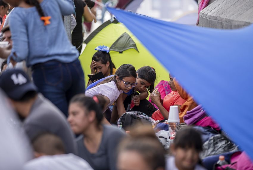 Migrants camp out at the base of the Paso del Norte International Bridge in Ciudad Juárez.