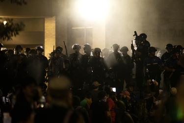 Austin police officers fired tear gas at a crowd Saturday.