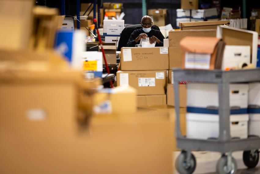 A Harris County Elections Staff member at the Elections Technology Center warehouse in Houston on March 1, 2022.