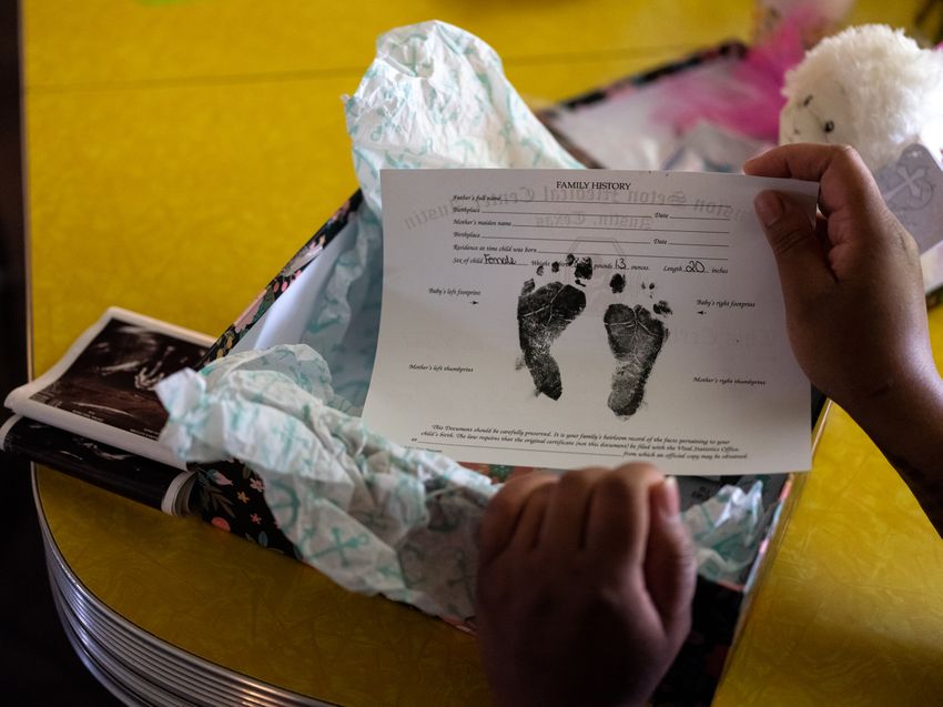 AUSTIN, TEXAS - June 14, 2023: Elena Andres holds a box given to her by the hospital after she delivered her stillborn daughter. Ilana Panich-Linsman for The Texas Tribune