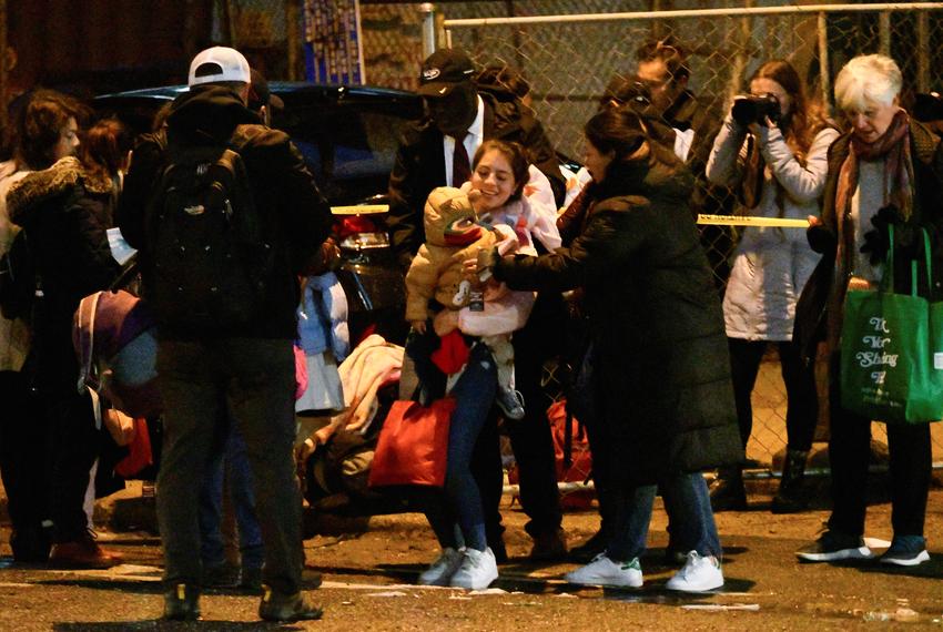 Migrants transported from Texas get off their bus in Philadelphia on Nov. 16.