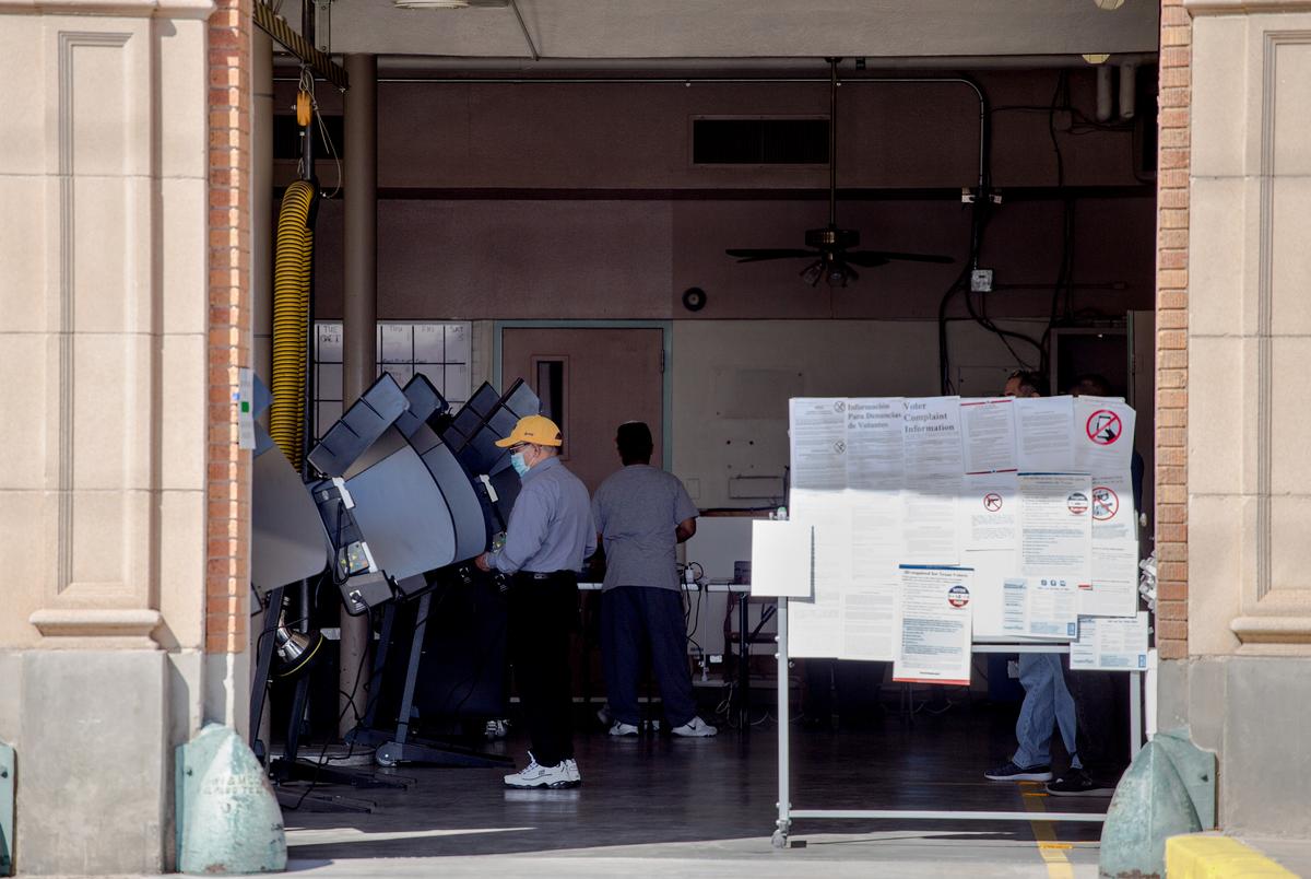 A voter casts their ballot at a polling station at the El Paso Fire Department Fire Station No. 3 on election day in El Paso. Nov. 3, 2020.