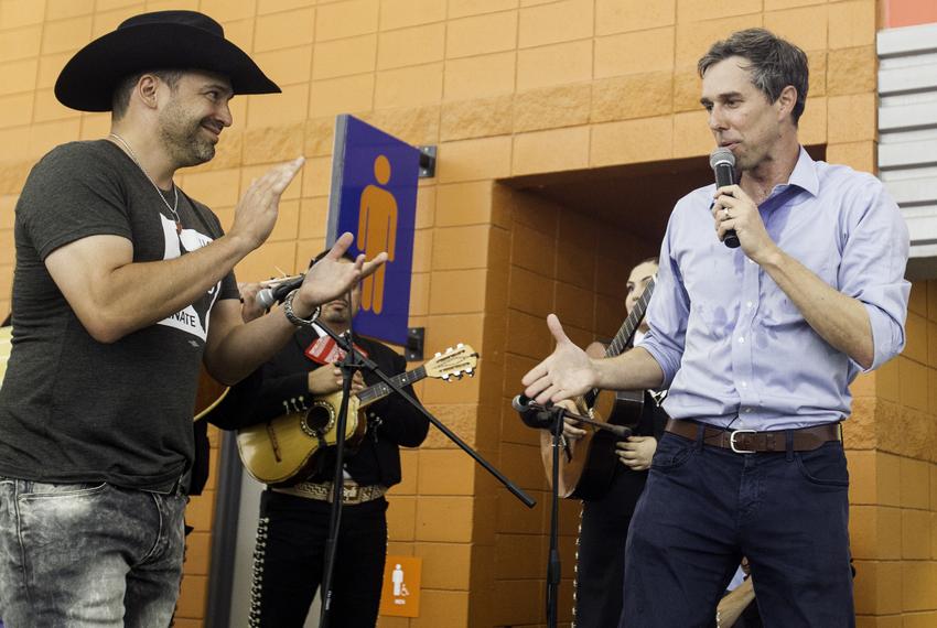 Tejano music star Bobby Pulido joins then-Senate candidate Beto O'Rourke during a campaign rally at HEB Park in Edinburg on May 1, 2018.