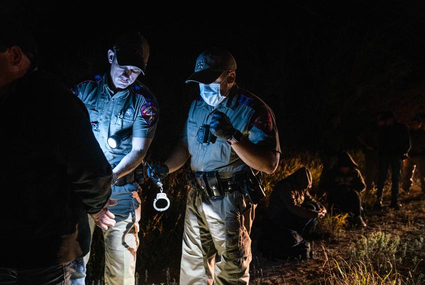 State Troopers arrest an undocumented Mexican migrant for trespassing as part of Operation Lone Star after he was caught with others in private property in Kinney County, Texas on Nov. 9, 2021.