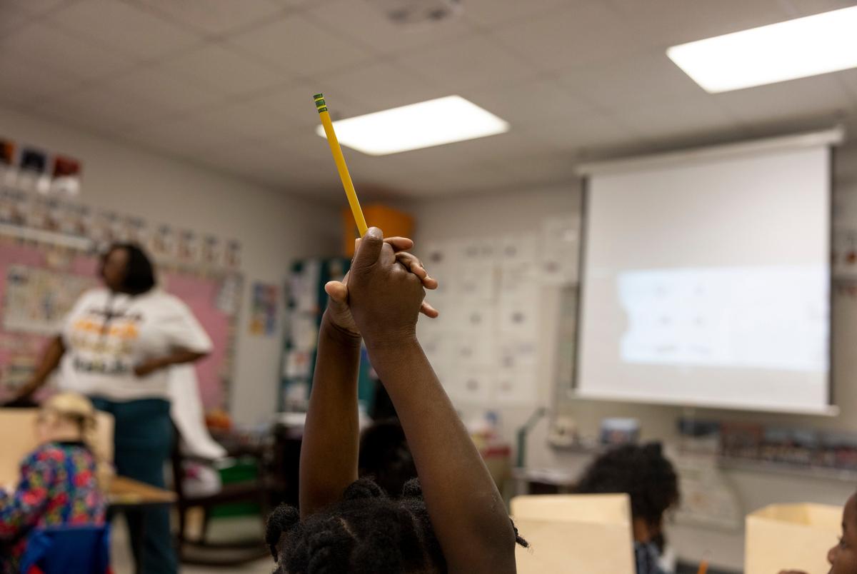 Temple, Texas  - 4/17/25: JoMeka Gray teaches a class of kindergarteners at Kennedy-Powell Elementary in Temple, Texas. Ilana Panich-Linsman for The Texas Tribune
