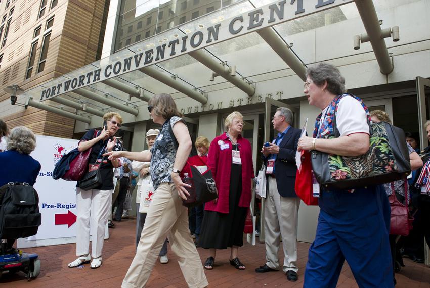 Texas Republican Convention delegates congregate outside the Fort Worth Convention Center on June 7, 2012.