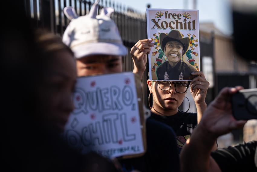 Protesters hold signs up during a rally for the release of Catalina “Xochitl” Santiago, a DACA recipient who was detained by immigration agents at El Paso International Airport in August, outside of the El Paso Service Processing Center, an immigration detention center in El Paso on Wednesday, Sept. 10, 2025.