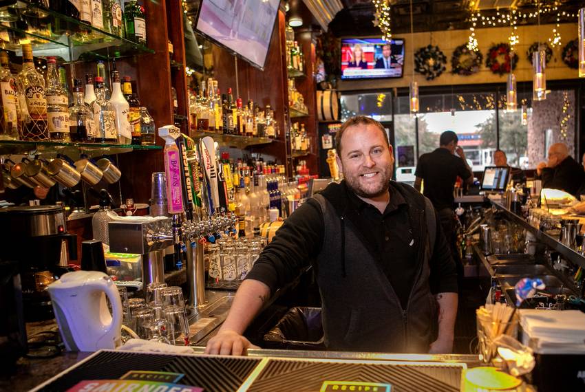 Lee Daugherty, owner of Alexandre's Bar in Dallas, pays his bartenders $8 an hour with a $15 per hour guarantee. The legal minimum wage for service workers who receive tips is $2.13 per hour.