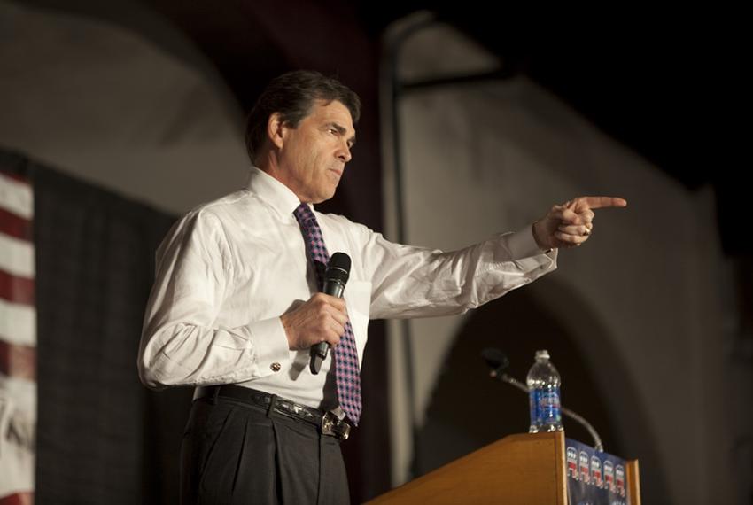 Gov. Rick Perry takes a question at the Black Hawk County Republican Party's Lincoln Day Dinner in Waterloo, Iowa, on Aug. 14, 2011.