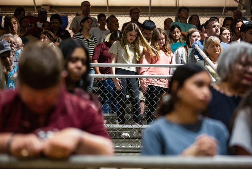 People pray during the vigil at Uvalde County Fairplex on Wednesday, May 25, 2022.