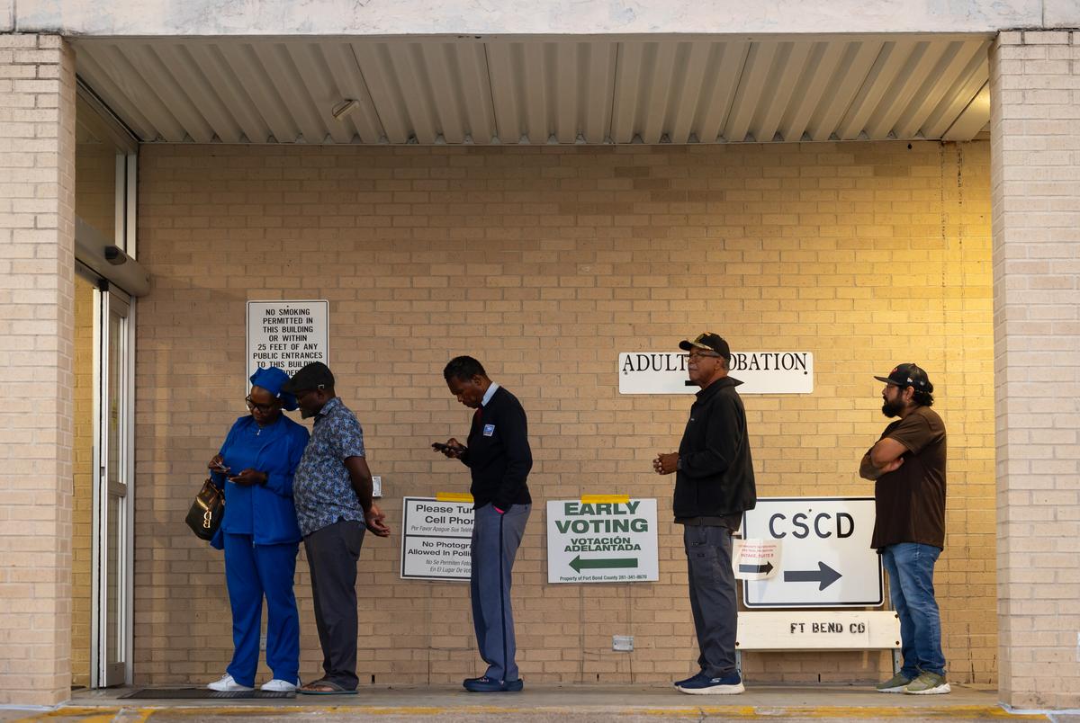 Voters line up outside of the Rosenberg Annex as early voting begins in Texas on Monday, Oct. 21, 2024, in Rosenberg.