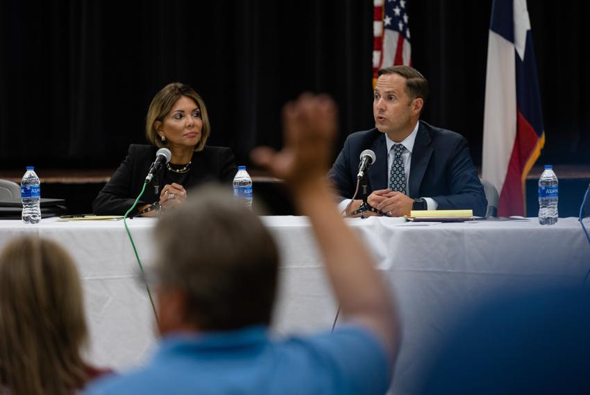 Former state Supreme Court Justice Eva Guzman and state Rep. Dustin Burrows, R-Lubbock, of the Investigative Committee on the Robb Elementary Shooting, listen to questions posed by the press during a conference in the Civic Center in Uvalde on July 17, 2022.
