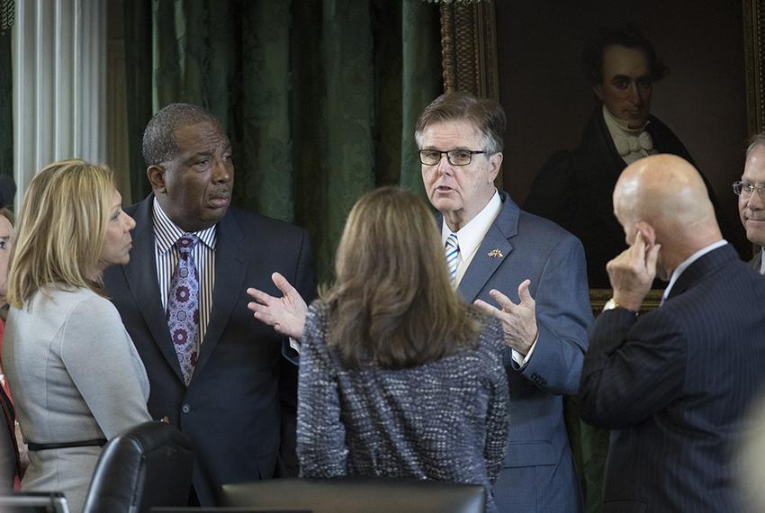 Lt. Gov. Dan Patrick confers with a group of senators during the special session on July 19, 2017.