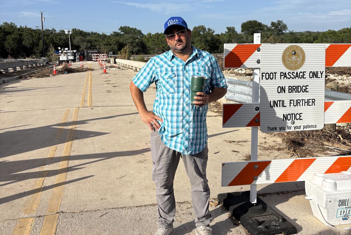 Abraham Stallins, on the flood-damaged bridge in Sandy Creek. The deck of the structure shifted several inches, isolating his community until a temporary crossing could be built.
