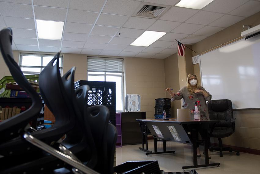 Freshman English teacher Sandra Grogan explains to another teacher how she plans to arrange her classroom at Judson High School on Tuesday, Aug. 11, 2020 in Converse. Grogan said she researched the best ventilation practices for COVID-19 prevention before positioning her desk under an air vent and in front of a whiteboard.