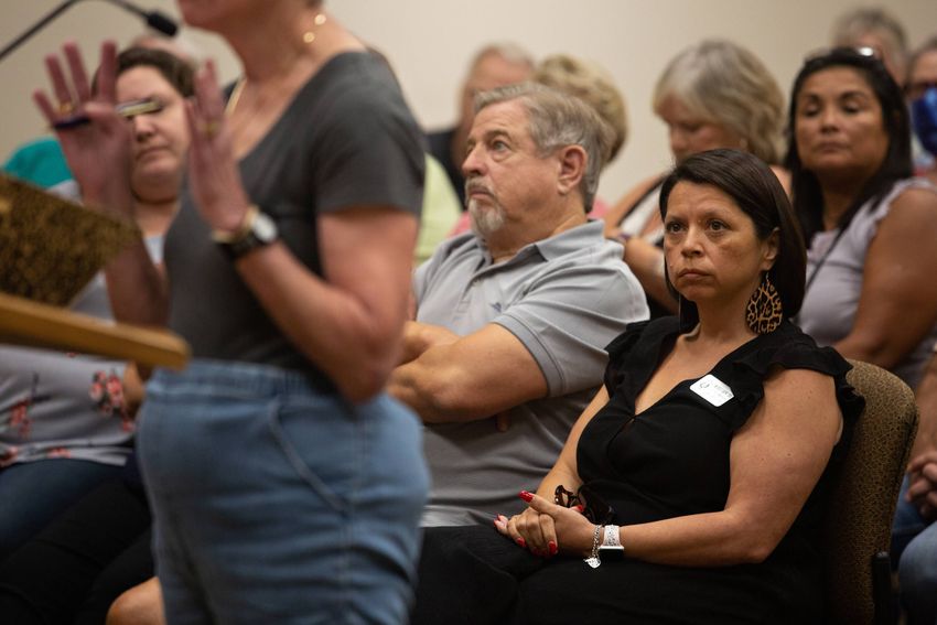 Election Administrator Michele Carew listens to public comments on her possible termination as Election Administrator during…