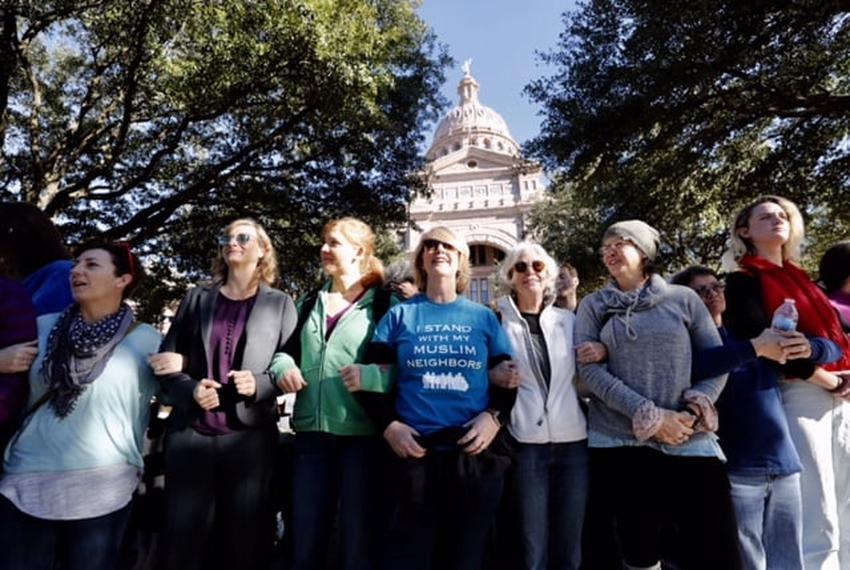 Supporters create a human shield for participants attending Texas Muslim Capitol Day on Jan. 31, 2017.