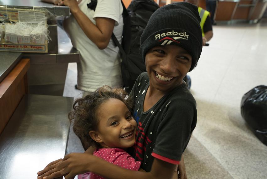 Jose and his sister, Genesis, smile and play at the McAllen Central Station. The Hernandez family waited for days on the Brownsville/Gateway Port of Entry to apply for asylum and now were at the station to get bus tickets. On June 23, 2018.