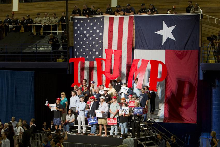 Supporters of Republican Presidential nominee  Donald Trump, hold up letters to spell his name during an August 23, 2016 rally in Austin, Texas