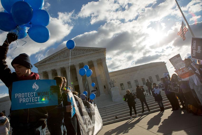 Protesters on both sides of the issue face off in front of the U.S. Supreme Court on Capitol Hill in Washington, D.C. as Whole Woman’s Health v. Hellerstedt is argued inside, March 2, 2016. The case is focused on Texas law HB2, which if enforced would result in the closure of more than 75 percent of all women’s health clinics that provide abortion services in the state.