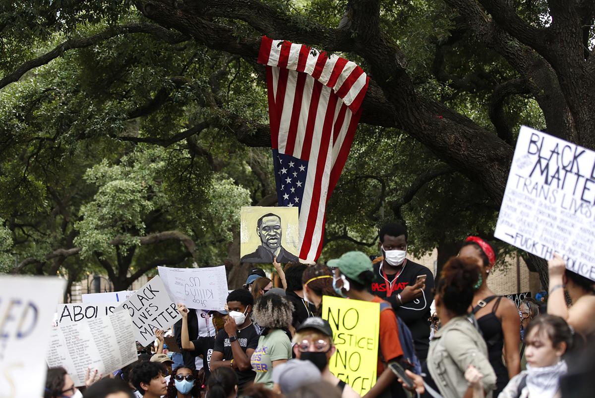 Protesters gathered at a rally for George Floyd in Houston. Floyd, a former Houston resident, was killed in Minneapolis police during an attempted arrest.