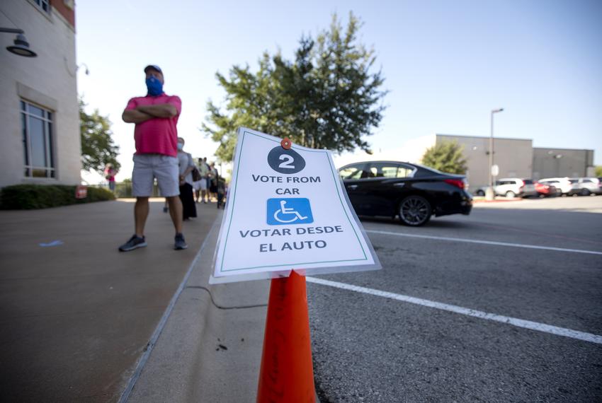 A curbside voting sign at the Bee Cave City Hall polling site. Oct. 14, 2020.