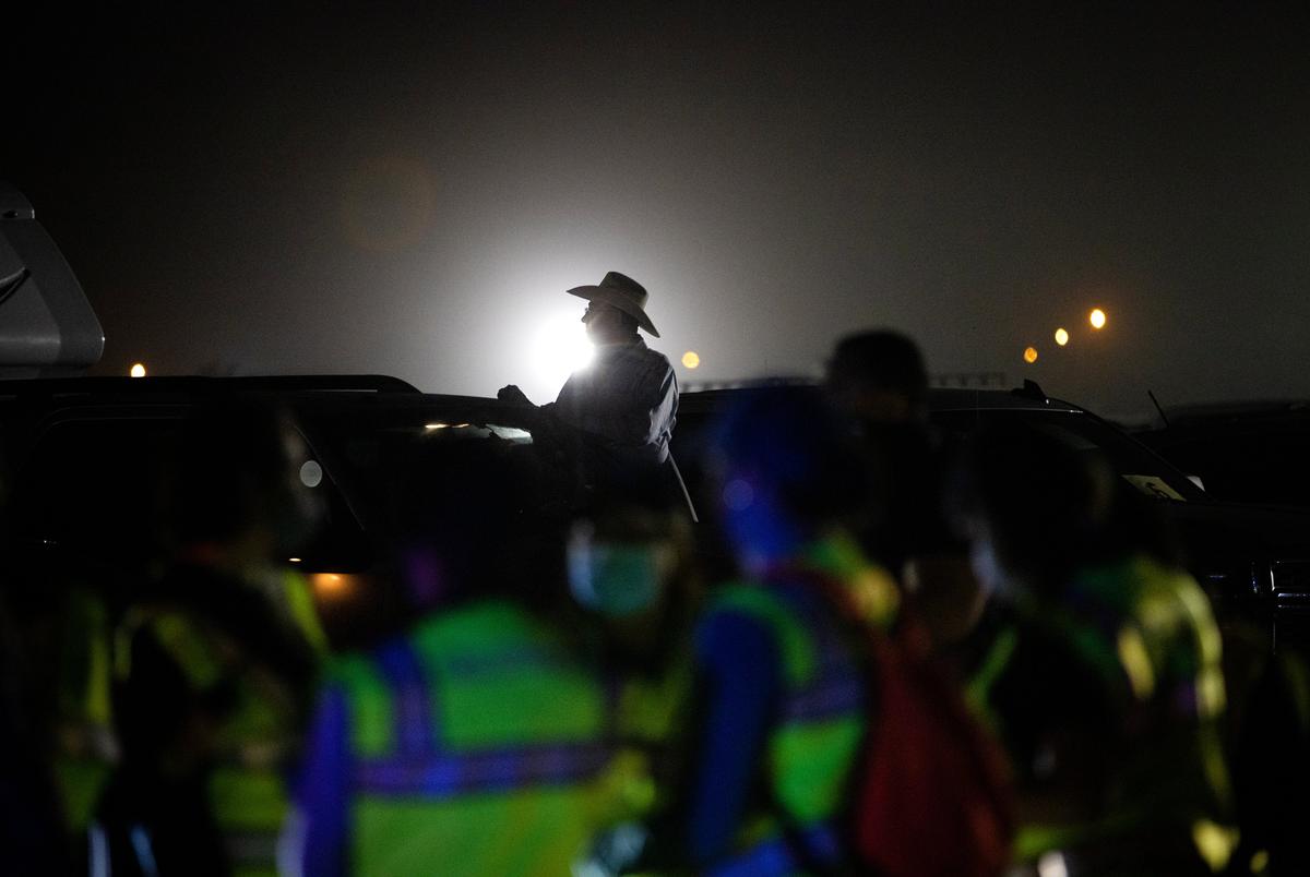 Cameron County residents wait to recieve the COVID-19 vaccine at a drive-in distribution site in Los Fresnos on Jan. 22, 2021.